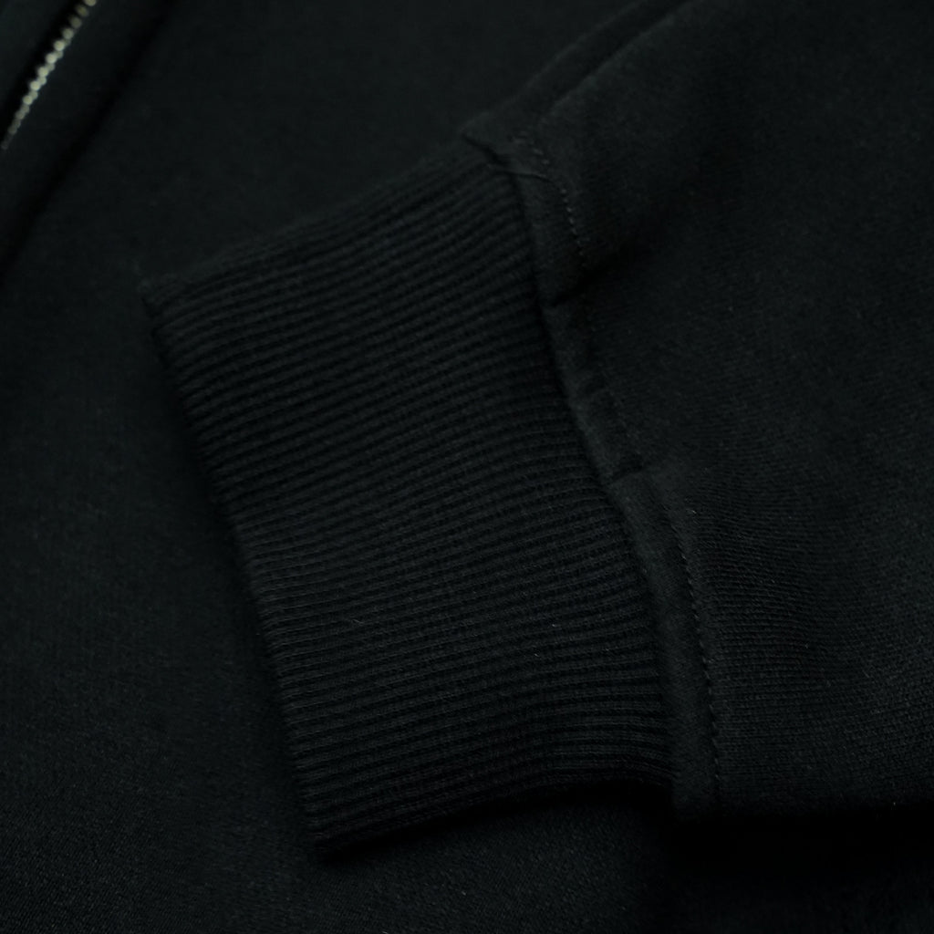 SUDADERA CON CREMALLERA Y CAPUTCHA REFLECTANTE [NEGRA]